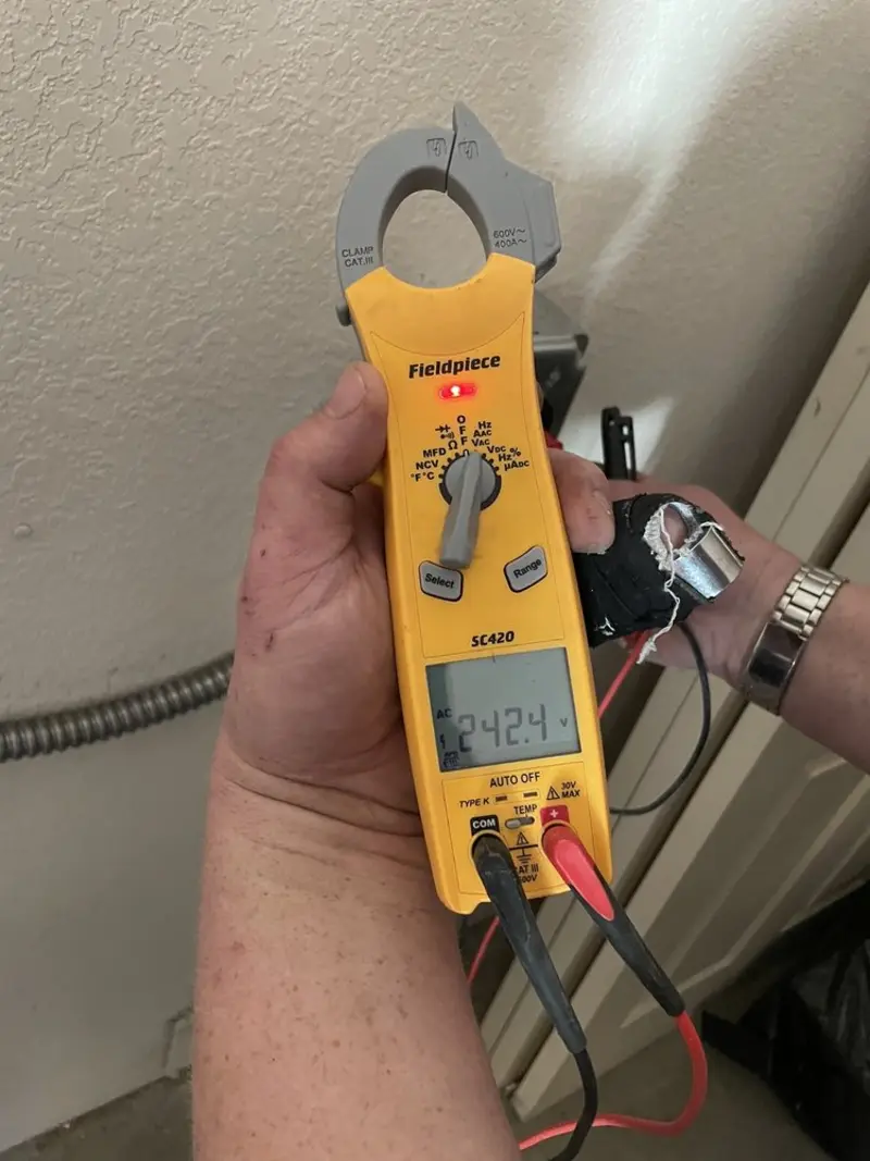 Voltage testing with clamp meter during Outlet Installation in Kerman